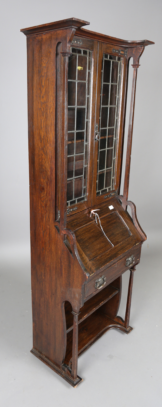 An early 20th century Arts and Crafts oak bureau bookcase, in the manner of Liberty & Co, height - Image 4 of 9