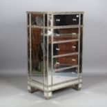 A modern mirrored and silvered chest of five drawers, height 129cm, width 76cm, depth 51cm.Buyer’s