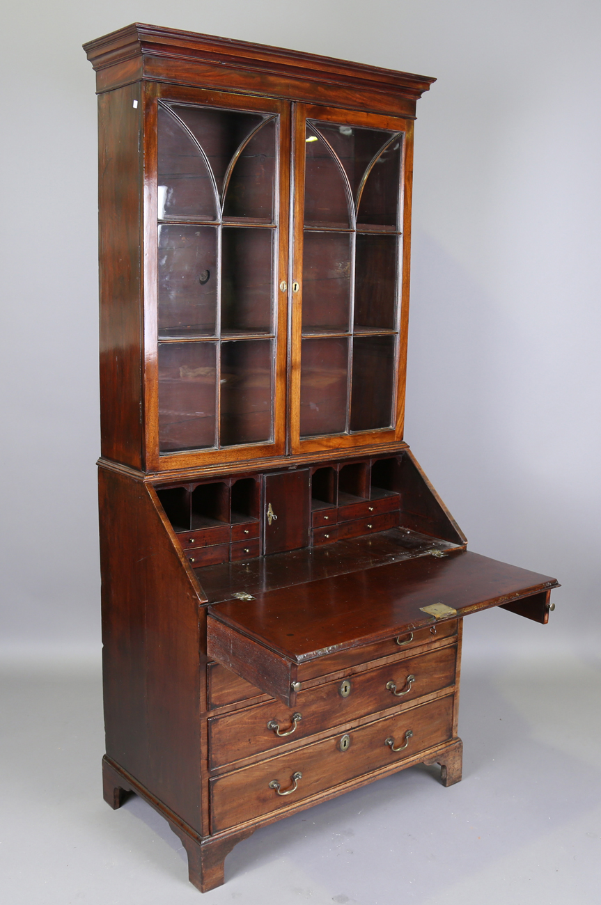 A George III mahogany bureau bookcase, the glazed top above a fall flap and an arrangement of oak- - Image 8 of 10