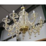 A large 20th century Murano glass twelve-light chandelier, fitted with daffodil and leaf mounts,