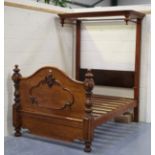 A mid-Victorian mahogany framed half-tester bed with moulded canopy support and arched headboard,