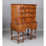 An early 18th century walnut chest-on-stand, the oak-lined drawers with later brass handles,