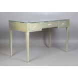 A modern Julian Chichester grey painted dressing table with a mirrored top and three drawers, height