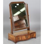 A George III mahogany swing frame mirror, height 64cm, width 45cm, together with a wall mirror, 58cm