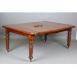 A late Victorian walnut extending dining table, the top fitted with a single extra leaf, height