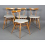A set of four mid-20th century Ercol beech and elm stacking chairs, height 74cm, width 41cm.Buyer’