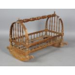 A late 19th/early 20th century Turkish softwood and bentwood rocking cradle, height 68cm, length