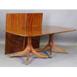 A modern George III style hardwood dining table by William Tillman, fitted with two extra leaves,