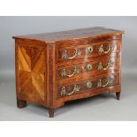 An early 18th century Italian yew and walnut three-drawer serpentine fronted commode with