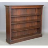An Edwardian walnut and oak open bookcase, fitted with three adjustable shelves, height 118cm, width