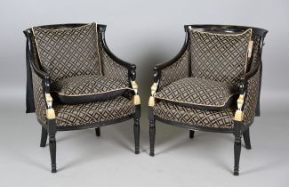 A pair of late 19th century Continental ebonized and parcel gilt showframe armchairs with tub
