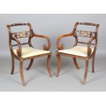 A set of eight Regency simulated rosewood and gilt brass mounted dining chairs, the centre rails