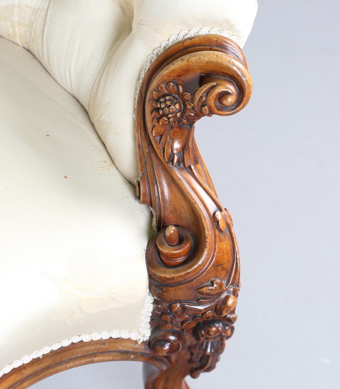 A fine mid-Victorian walnut showframe salon settee, the frame carved with flowers, leaves and fruit, - Image 4 of 11