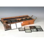 A collection of glass magic lantern slides, the majority depicting Japanese woodblock prints and