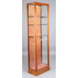 A late Victorian mahogany framed shop display cabinet, fitted with a single glazed door, height