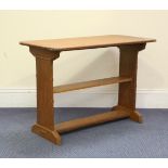An early 20th century Arts and Crafts Cotswold School oak occasional table with overall chamfered