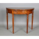 A William IV figured mahogany demi-lune fold-over card table with ebony stringing, height 75cm,