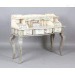 A 20th century Continental painted softwood writing desk, the galleried top above three drawers,