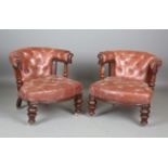 A pair of mid-Victorian mahogany tub back easy chairs, upholstered in buttoned brown leather and