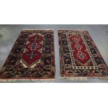 A Turkish rug, late 20th century, the red field with three medallions, within a blue palmette