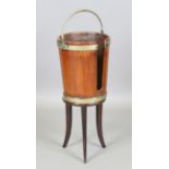 A late George III mahogany coopered plate bucket with two brass straps and swing-over handle, height