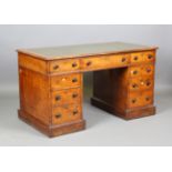 A mid-Victorian pollard oak twin-pedestal desk, the moulded edge top inset with gilt-tooled green