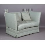 A modern Knole two-seat settee, upholstered in palmette patterned pale green damask, height 107cm,