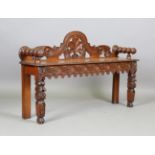 A late Victorian oak window seat with carved foliate decoration, height 75cm, width 122cm, depth