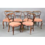 A set of six Victorian rosewood spoon back dining chairs, height 84cm, width 45cm (some repairs).
