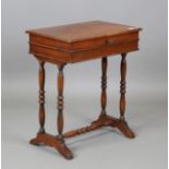 A Victorian walnut work table, the hinged top on turned supports, height 68cm, width 57cm, depth