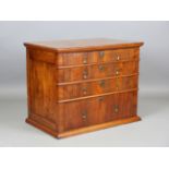 An early 18th century walnut chest of drawers with line inlaid borders and brass drop handles,