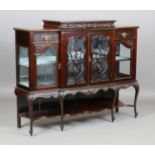 An Edwardian mahogany side cabinet, fitted with drawers and glazed doors, on cabriole legs, height