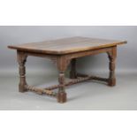 A late 19th century Jacobean Revival oak refectory table with a thick four-plank top, height 72cm,