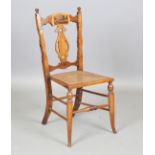 A late Victorian Tunbridge ware walnut framed bedroom chair with a cane work seat and an unusual