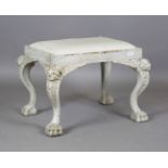 An 18th century style Irish painted mahogany stool, the cabriole legs carved with amorini mask