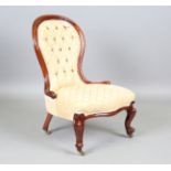 A Victorian walnut showframe lady's salon chair, upholstered in patterned gold damask, height