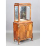 A late 19th/early 20th century French walnut vitrine with inset marble top and gilt metal mounts,