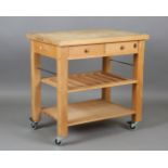 A late 20th century beech butcher's block style kitchen serving unit by Servus, fitted with two