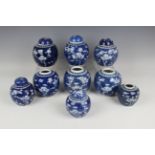 A collection of nine Chinese blue and white porcelain ginger jars and five covers, 20th century,