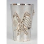 A Chinese silver beaker, early 20th century, of tapering cylindrical form, decorated in relief