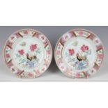 A pair of Chinese famille rose export porcelain plates, Yongzheng period, each painted with a
