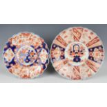 Two Japanese Imari porcelain circular dishes, Meiji period, each of lobed form, painted with