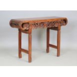 A Chinese hardwood scholar's table, late Qing dynasty, the rectangular panelled top with curved ends