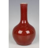 A Chinese sang-de-boeuf glazed porcelain bottle vase, height 18cm.Buyer’s Premium 29.4% (including