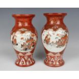 A pair of Japanese Kutani porcelain vases, Meiji period, each baluster body painted and gilt with