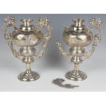 A pair of Chinese silver vases, early 20th century, each globular body decorated with a dragon or