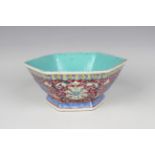 A Chinese famille rose hexagonal bowl, mark of Qianlong but late Qing dynasty, the exterior