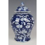 A Chinese blue and white porcelain jar and cover, mark of Kangxi but late Qing dynasty, the baluster