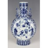 A Chinese blue and white moonflask, late 19th century, painted with opposing figural panels within a