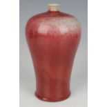 A Chinese sang-de-boeuf glazed porcelain meiping, covered in a streaky oxblood glaze, height 22.